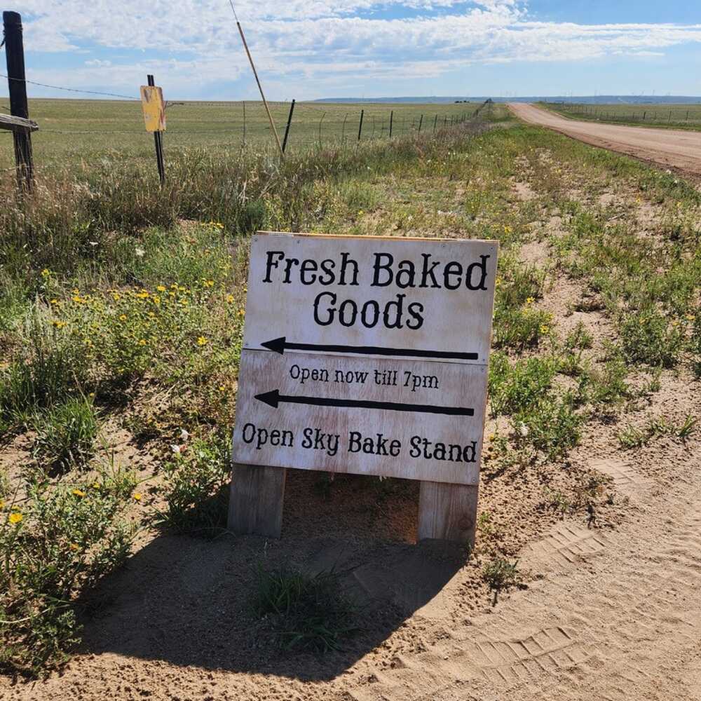 Open Sky Bake Stand road sign, shown in full, on Eureka Road